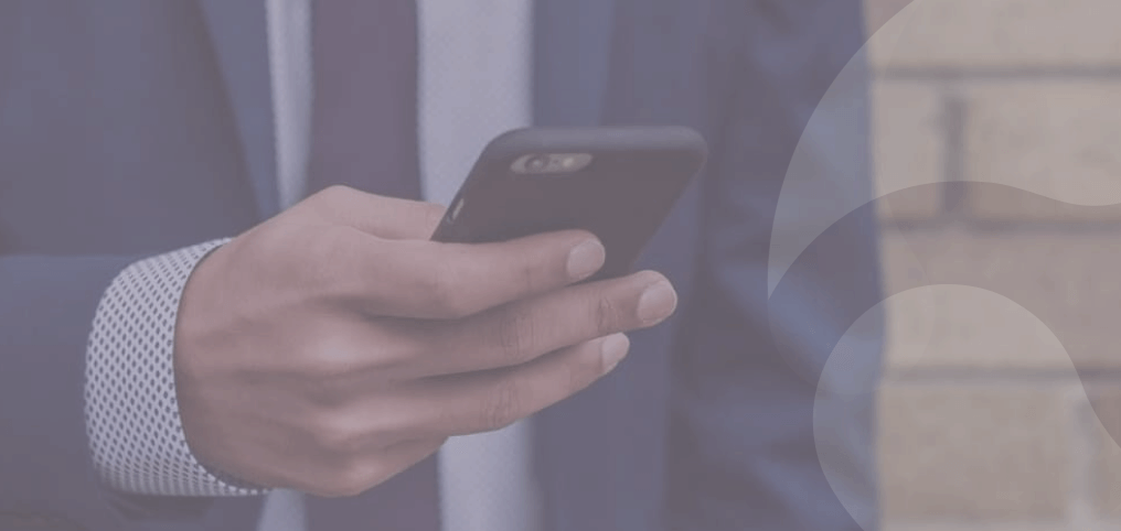 businessman typing a message on a phone