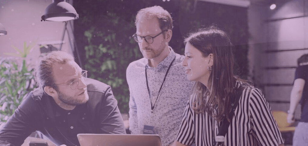 group of coworkers talking in office