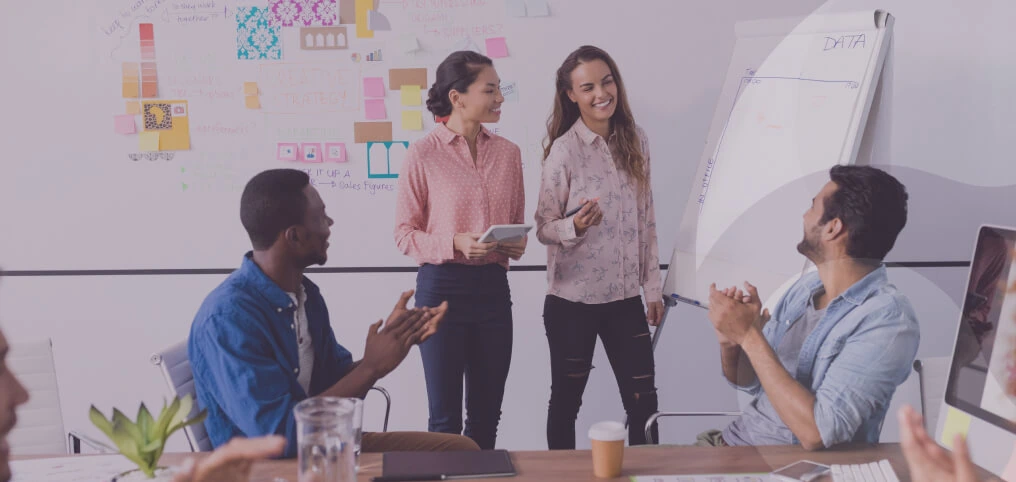 women holding presentation in office