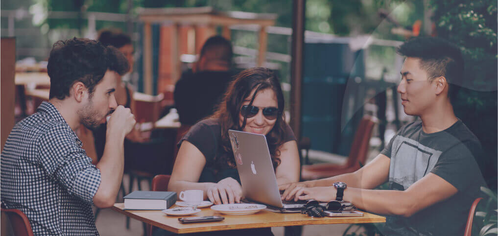 a bunch of young employees drinking coffee and chatting