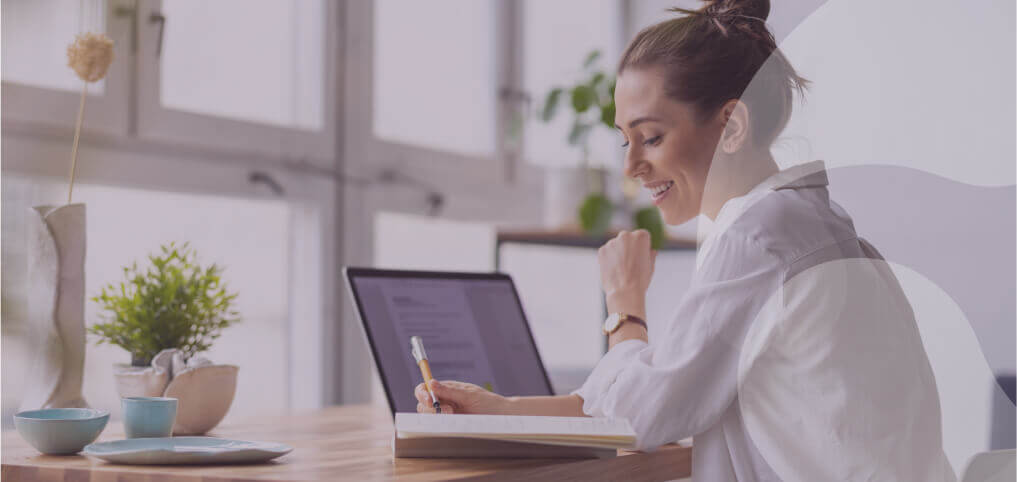 a happy, successful woman writing notes