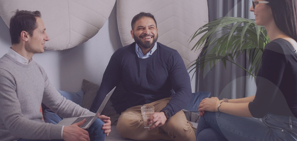 coworkers talking and laughing on a lunch break