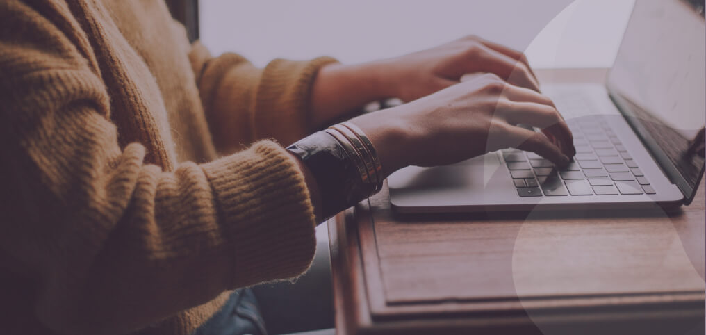 woman typing on laptop