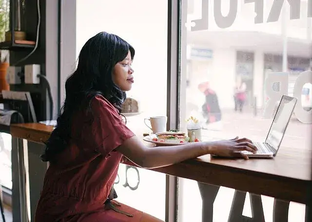 a businesswoman working remotely from a café