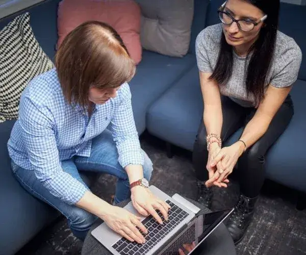 woman typing on laptop