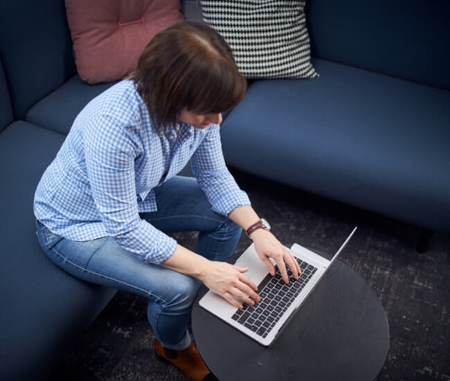 woman typing on laptop