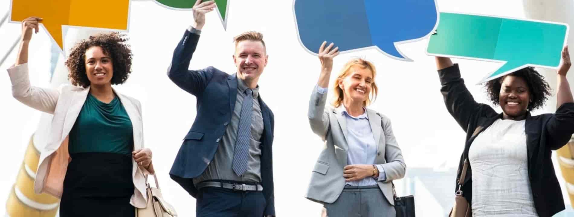 employees posing with message boxes